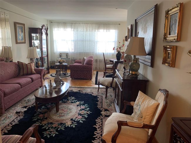Living room with wood finished floors | Image 9
