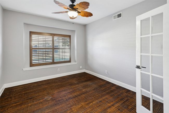 Spare room featuring hardwood / wood-style floors and ceiling fan | Image 25
