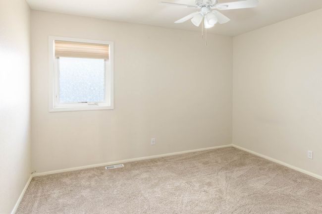 Unfurnished room featuring ceiling fan and carpet floors | Image 10