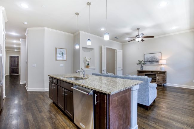 Kitchen flows seamlessly to living area. | Image 14