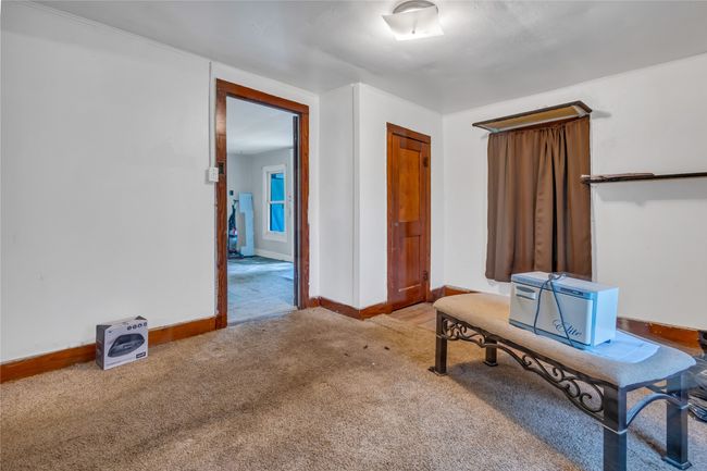 Home office with carpet flooring and baseboards | Image 7