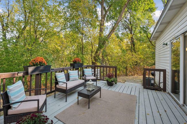 Deck off the back of the house from the family room. Access from either side of the yard with beautiful views. | Image 53