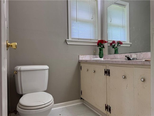 Bathroom with vanity and healthy amount of natural light | Image 15