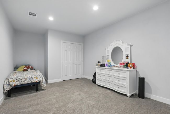 Carpeted bedroom with baseboards, recessed lighting, and a closet | Image 30