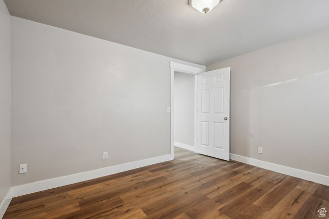 Spare room featuring hardwood / wood-style flooring | Image 35