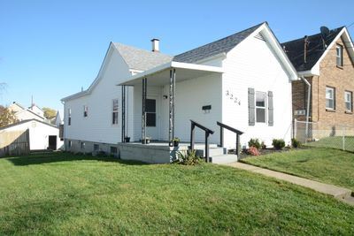 3224 Watson offers fenced yard, front porch, deck and two car garage. | Image 1