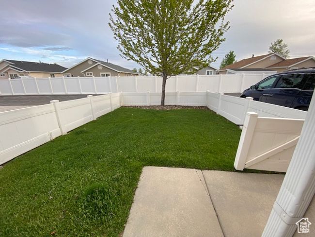 View of yard featuring a fenced backyard and a residential view | Image 22