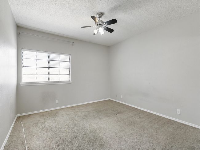 Bedroom with carpet & mirrored closet. | Image 27