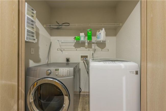 Clothes washing area with washer and clothes dryer and laundry area | Image 14