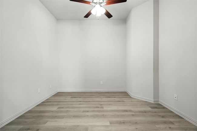Unfurnished room featuring a ceiling fan and light wood-type flooring | Image 27
