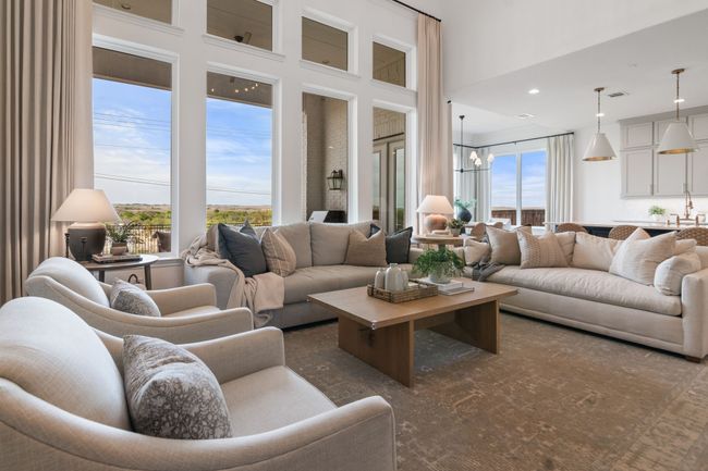 Living room with a chandelier and recessed lighting | Image 6