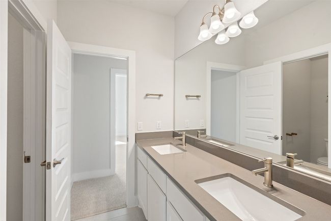 Bathroom featuring a chandelier and double vanity | Image 33