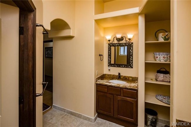 Bathroom with vanity, built in features, and tile patterned floors | Image 60