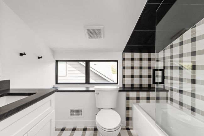 Full bathroom featuring toilet and vanity | Image 31