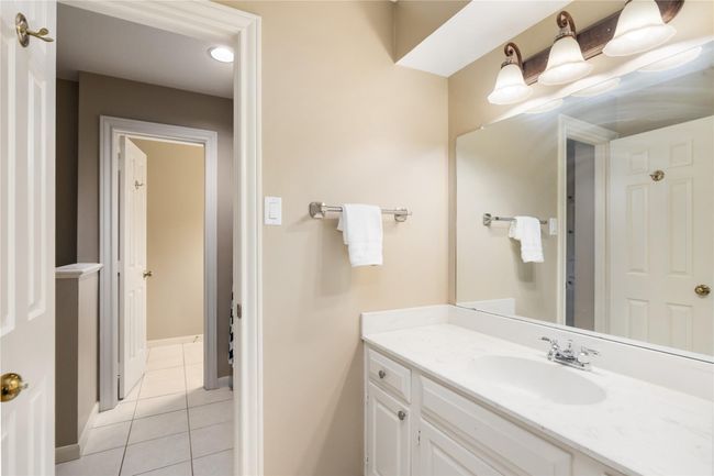 This additional full bathroom adds convenience for guests and residents alike, with a clean, timeless design that blends effortlessly into the home’s style. | Image 34
