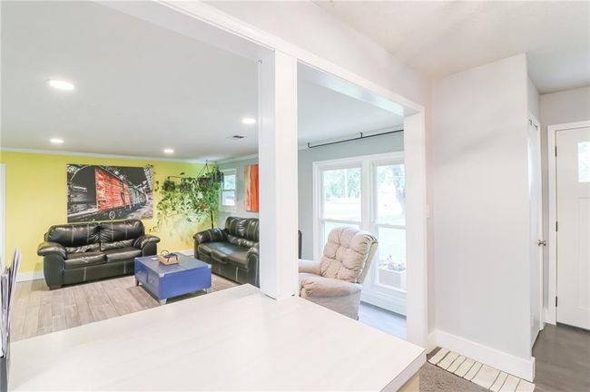Living room with recessed lighting and wood finished floors | Image 15