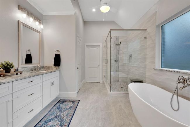Elegant dual sinks provide both function and style in the beautifully designed primary bath. | Image 27
