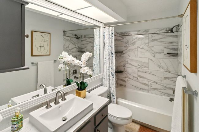 Stylish and upgraded secondary bathroom supporting the secondary bedrooms. | Image 17