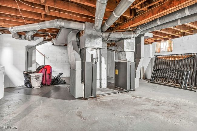 Below grade area featuring heating unit | Image 21
