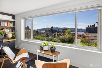 Kick back and relax in your peaceful home with views of the seaplane action at Lake Union. | Image 1