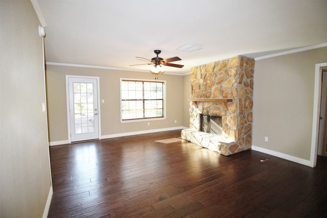 Large den with stone wood burning fireplace | Image 7