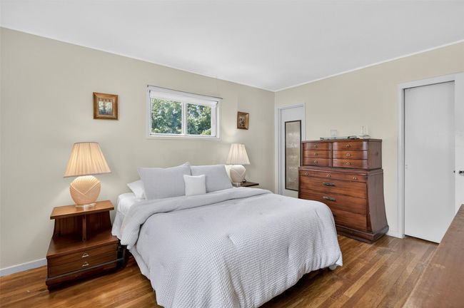Bedroom with wood finished floors and baseboards | Image 10