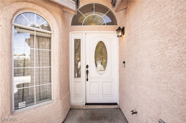 Property entrance with stucco siding | Image 4
