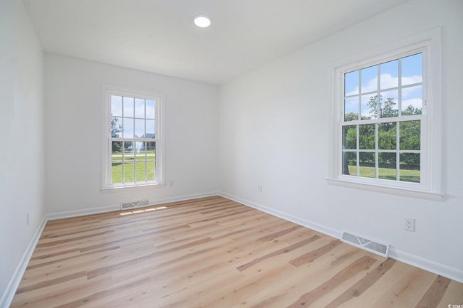 1st Guest Bedroom featuring 2 windows for an abundance of natural light. | Image 23