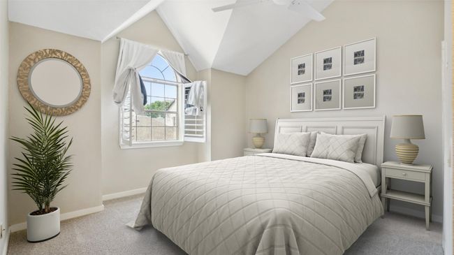 Bedroom with carpet flooring, baseboards, and vaulted ceiling | Image 18