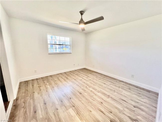Bedroom featuring LUXURY VINYL PLANK FLOORS. | Image 27