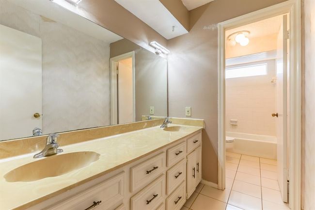 Full bath upstairs equipped with double sinks | Image 27