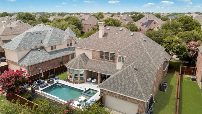 View of pool featuring a fenced backyard, a pool with connected hot tub, and a residential view | Image 32