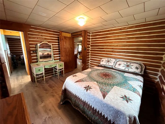 Bedroom featuring wood finished floors | Image 5