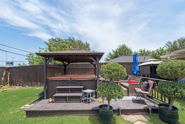 Wooden deck with a hot tub and a gazebo | Image 33