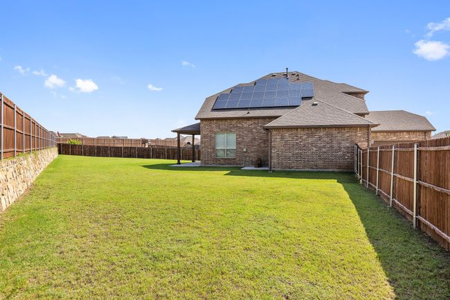 View of fenced backyard | Image 27