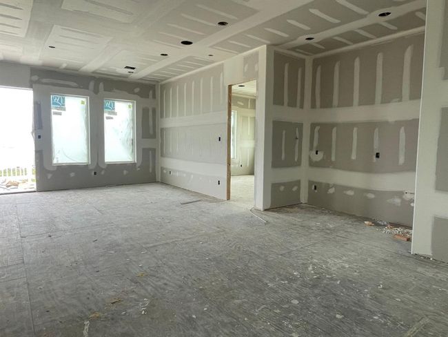 Cheers to coastal living! This wall will soon become a custom wet bar complete with beverage fridge and cabinetry—creating the perfect spot for guests to grab a drink and keep the good times going. | Image 39