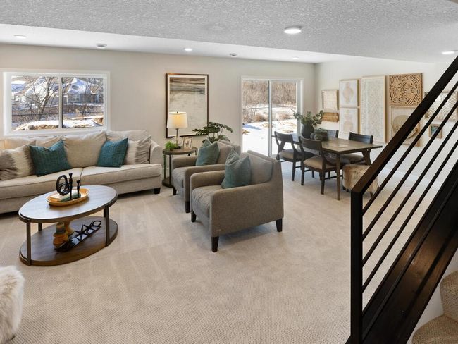 The finished lower level rec room offers a spacious, multifunctional area, perfect for entertainment, relaxation, or creating your ideal playroom or home theater. | Image 36