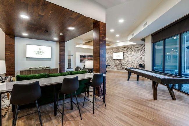 Bar with wooden ceiling, light hardwood / wood-style floors, and decorative columns | Image 21