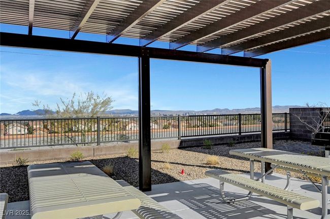 View of patio featuring a mountain view, a pergola, and a fenced backyard | Image 51