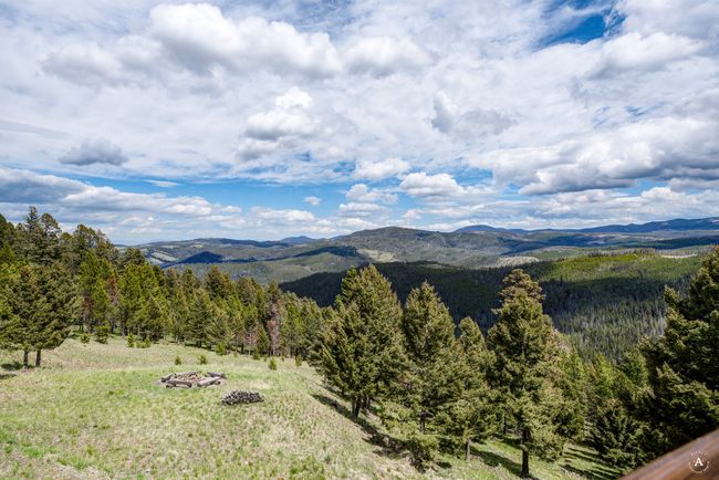 View of mountain backdrop featuring a heavily wooded area | Image 40