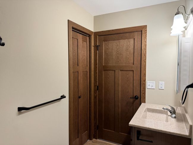 Oil-rubbed bronze hardware on doors, towel bars, robe hooks | Image 15