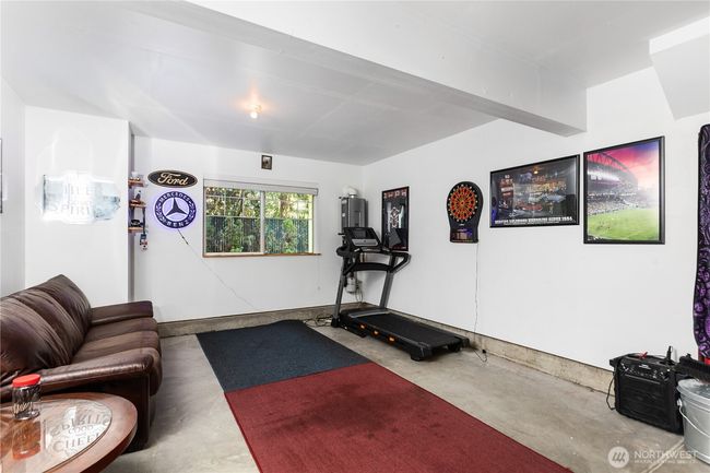 Oversized 2-car tandem garage can fit two cars or one car plus "man cave/gym." There is a car parked in the front half of the garage that you can't see in this picture! | Image 18
