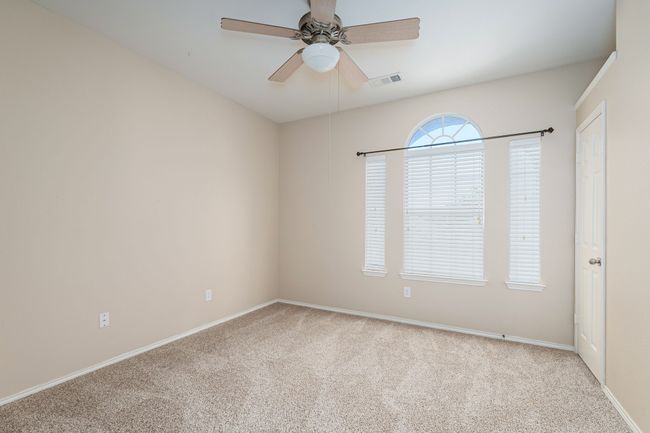 Unfurnished room featuring carpet and ceiling fan | Image 21