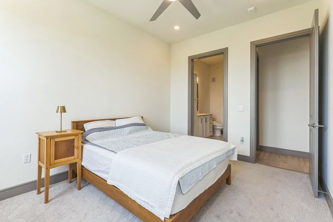 Bedroom with light carpet, recessed lighting, ensuite bath, and ceiling fan | Image 15