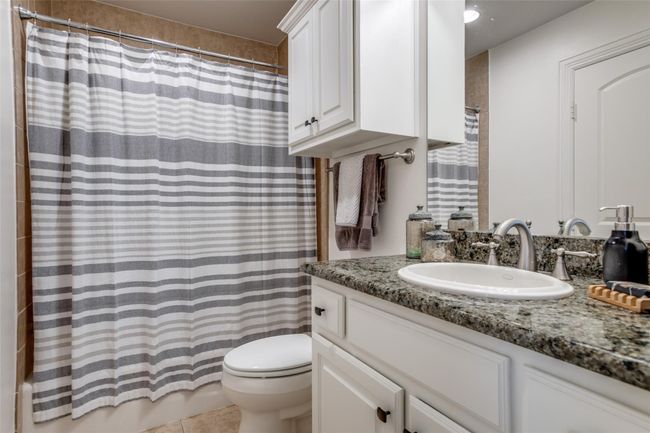 Full bath featuring vanity and tile patterned floors | Image 18