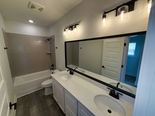 Spacious primary bedroom with tray ceiling and ceiling fan!! | Image 21