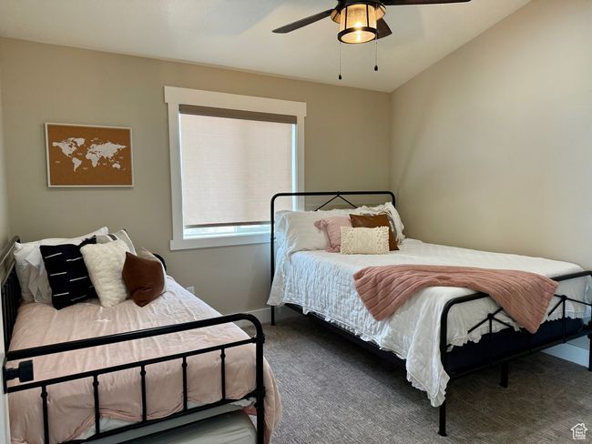 Carpeted bedroom featuring baseboards and a ceiling fan | Image 34