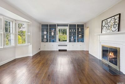 Formal Living Room with Wood burning Fireplace and Built-ins | Image 2