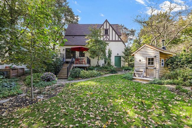For privacy, retreat to the shaded backyard, and enjoy your wood-fired sauna, fire ring, gardens, and multi-level deck with views of the lake. | Image 32