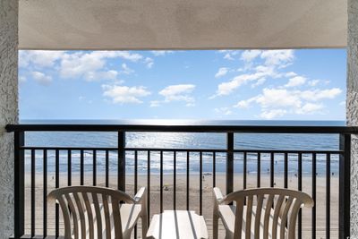 Balcony with a beach view and a water view | Image 3